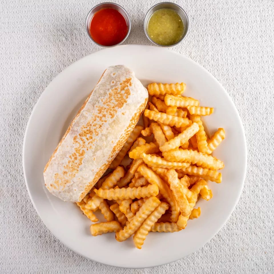 A Montecristo Taqueria y Pupuseria burrito with crinkle-cut fries and two dipping sauces on a white plate.